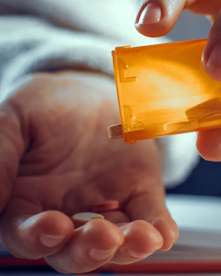 Pouring pills from a bottle